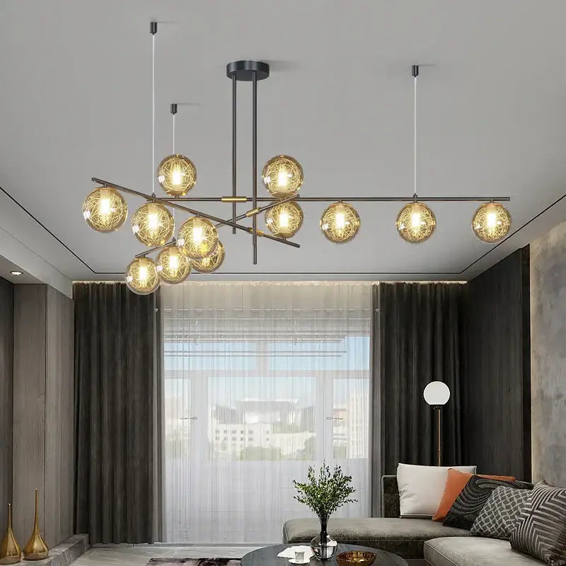 Decorbites glass ball chandelier with multiple warm glowing spherical glass bulbs on black metal arms for modern home decor