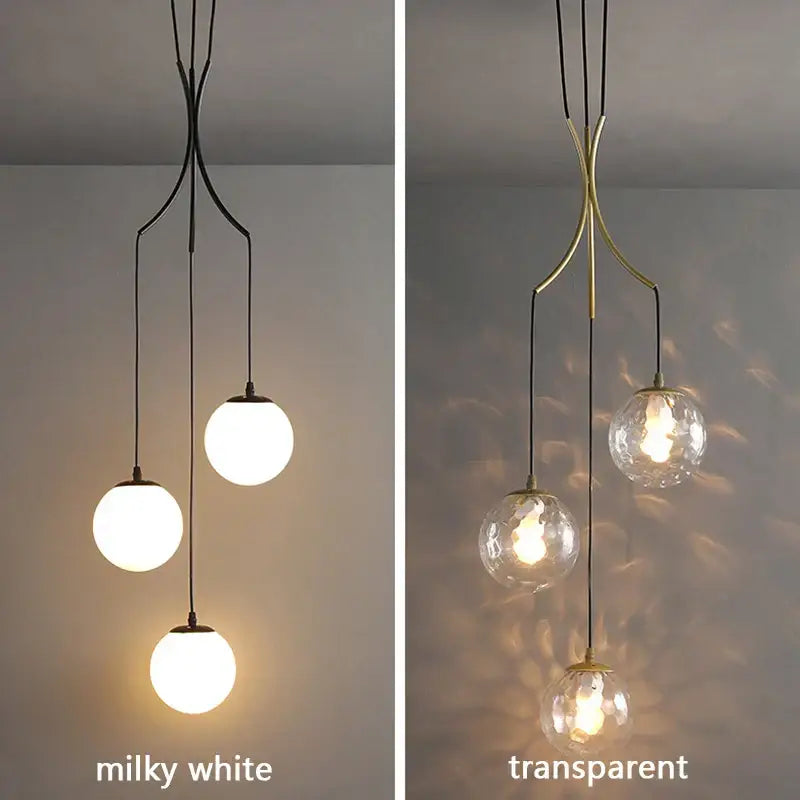 Milky white and transparent glass ball chandelier with black and brass metal arms for home living dining room by DecorBites glass ball