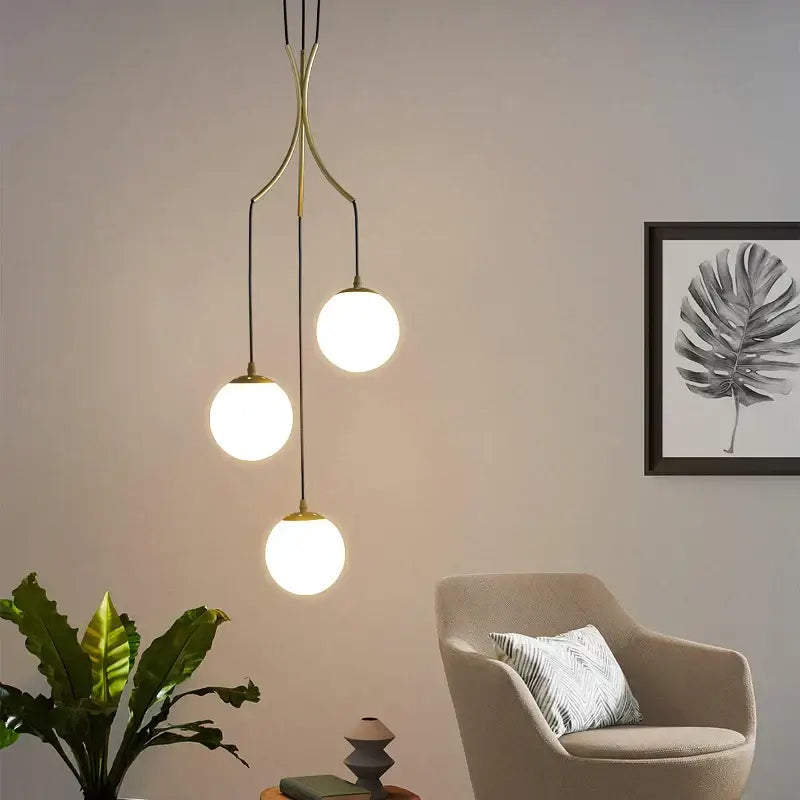 Modern brass decorbites glass ball chandelier ceiling pendant with three glowing spherical glass shades for living room use