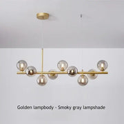 Golden decorbites™ glass ball chandelier with smoky gray glass globes and polished brass frame for living rooms and dining rooms