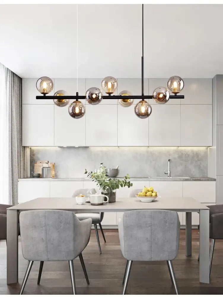 Modern black metal DecorBites™ glass ball chandelier with amber-tinted glass globe bulbs for dining room lighting