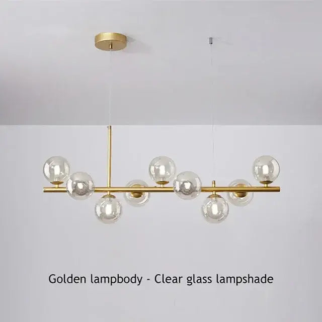 Golden decorbites™ glass ball chandelier with clear glass globe shades and sleek brass frame for home lighting