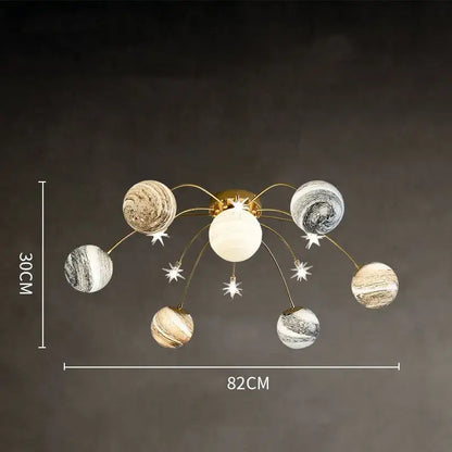 Gold-toned decorbites glass ball chandelier with six marbled planet-shaped globes for kids room and living room