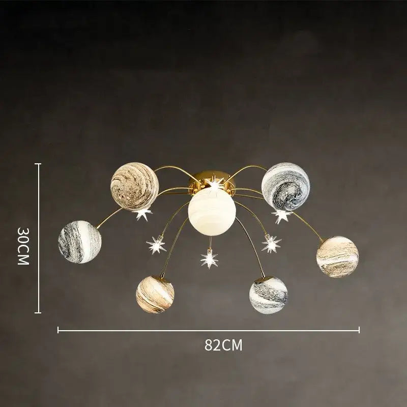 Gold-toned decorbites glass ball chandelier with six marbled planet-shaped globes for kids room and living room