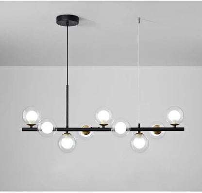 Black metal decorbites™ glass ball chandelier with clear glass globe bulbs and gold-toned accents for modern home lighting