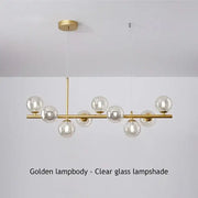DecorBites™ glass ball chandelier with clear glass globe shades and a sleek brass frame for modern home lighting