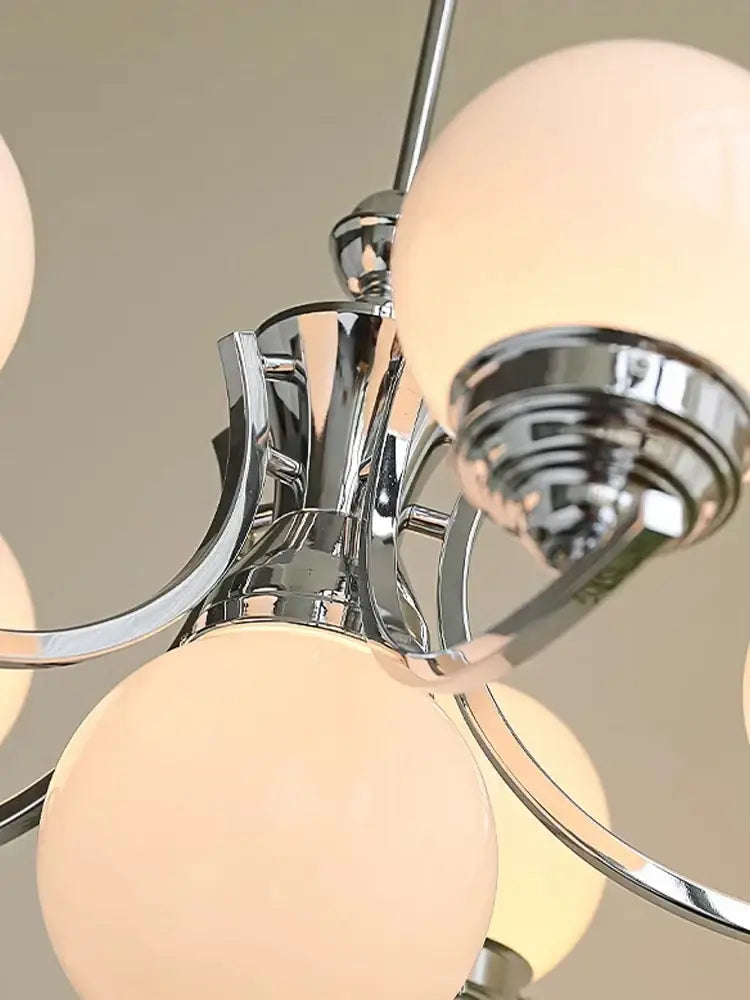 Chrome-finished decorbites glass ball chandelier with multiple frosted glass globe shades for modern room decor
