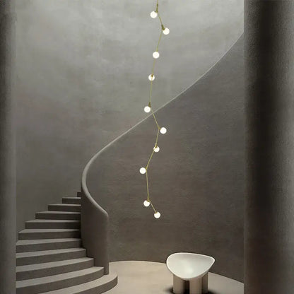 Decorbites glass ball chandelier features a gold-toned minimalist pendant light with spherical bulbs for villa decor