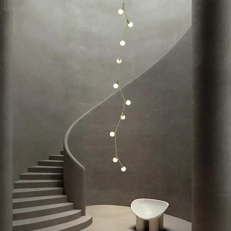 Decorbites glass ball chandelier features a gold-toned minimalist pendant light with spherical bulbs for villa decor
