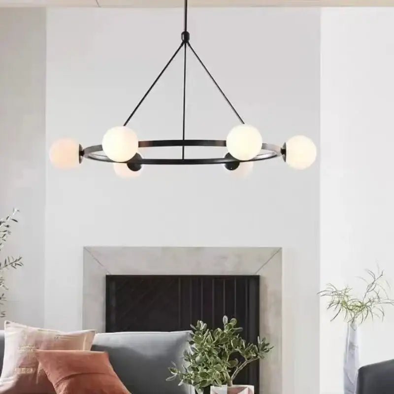 Black metal DecorBites glass ball chandelier with six frosted glass globes pendant light in modern Nordic style