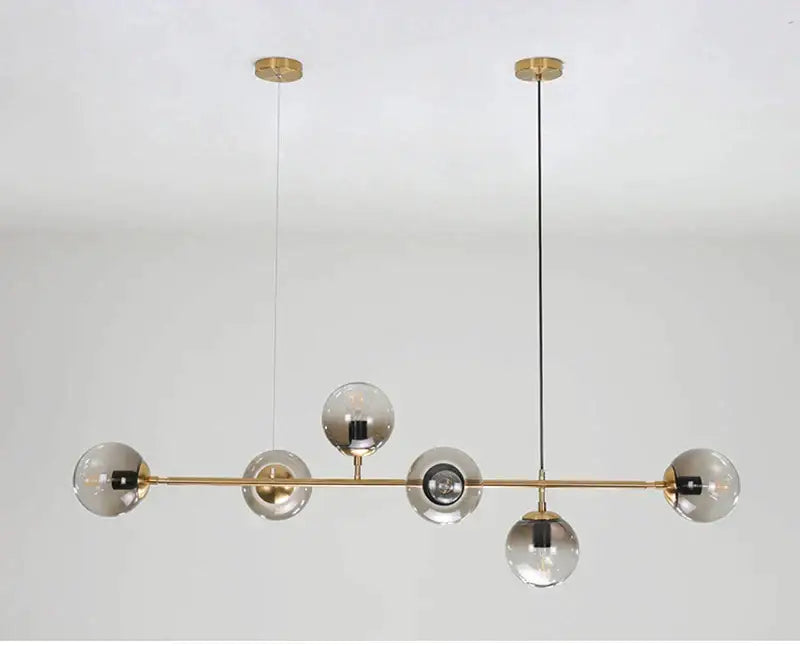 Modern brass DecorBites glass ball chandelier with five clear glass globes for kitchen bar and loft lighting