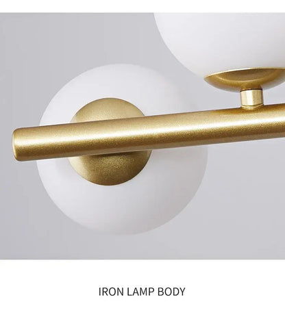DecorBites™ glass ball chandelier with gold-finished iron body and frosted white glass ball lighting fixture design