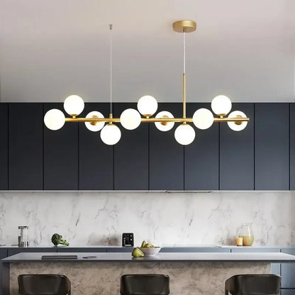 Gold-toned modern glass ball chandelier with multiple white glass bulbs in linear design lighting fixture for ceilings