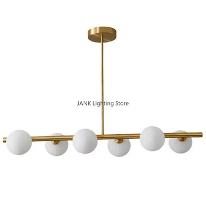 Decorbites glass ball chandelier with five frosted white glass globes on a gold-toned horizontal bar for modern home decor