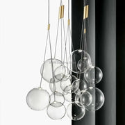 DecorBites glass ball chandelier with gold-toned metal accents and clear glass spheres for modern home decor