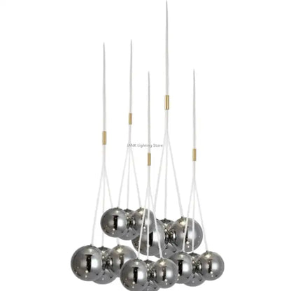 Modern chrome-finished decorbites glass ball chandelier with clear acrylic rods and gold-toned accents for home decor
