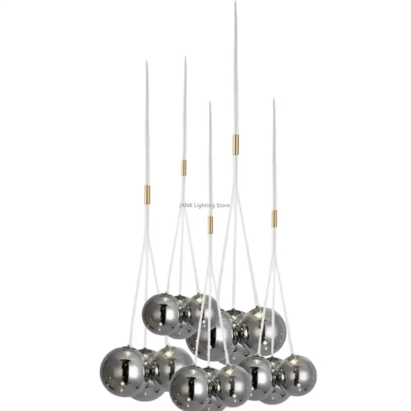 Modern chrome-finished decorbites glass ball chandelier with clear acrylic rods and gold-toned accents for home decor