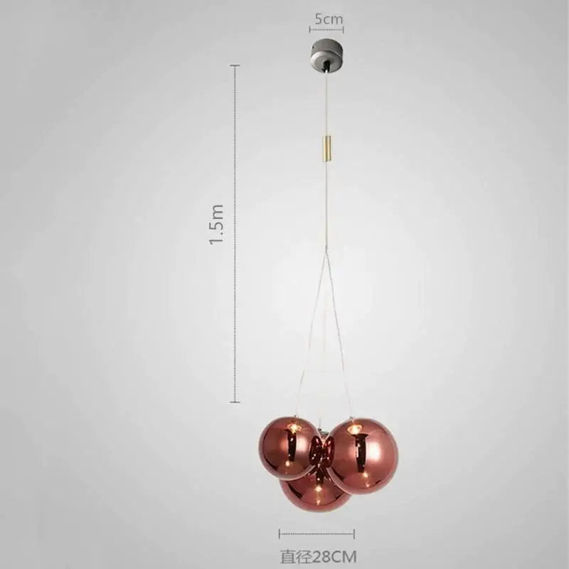 Rose gold spherical pendant light with modern minimalist design in DecorBites glass ball chandelier for home decor