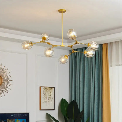 Gold-toned DecorBites™ glass ball led chandelier with clear glass globe bulbs and a branching metal frame in Nordic style