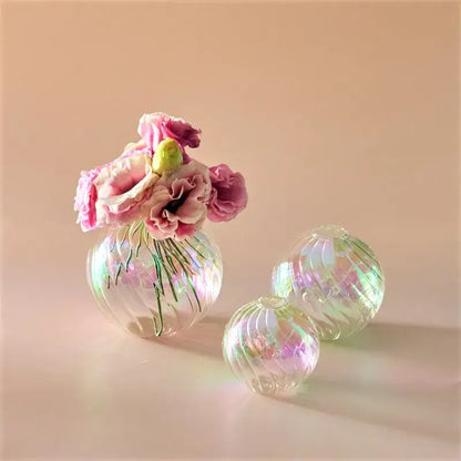 DecorBites™ glass ball vases set featuring iridescent spherical ribbed vases with pink flowers for elegant home decor