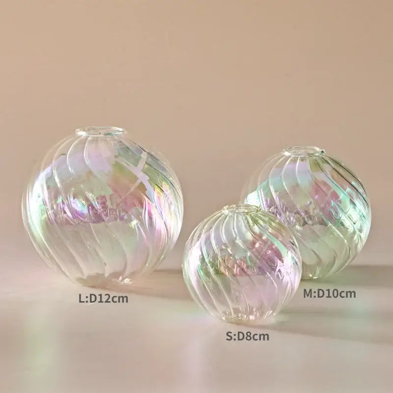 Set of three iridescent glass ball vases with swirling ribbed patterns in small medium and large for home decor vase set
