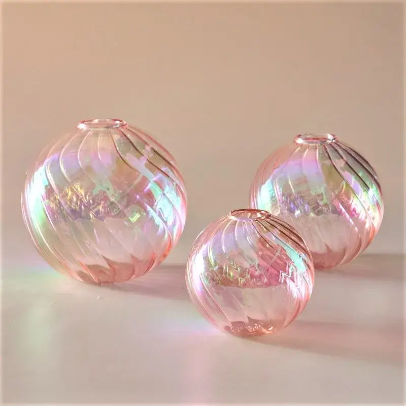 Set of three iridescent pink glass ball vases with swirling ribbed patterns for elegant home decor vase set