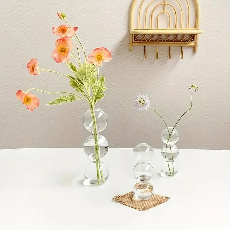 Decorbites glass bubble hydroponic vase with stacked transparent globes holding pink and white flowers for wedding and home