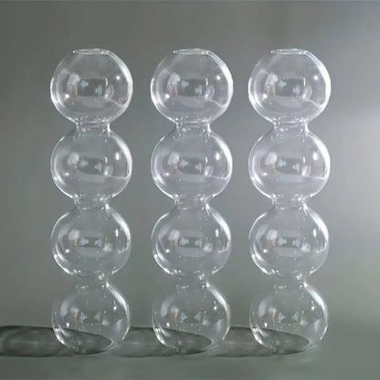 Three transparent glass bubble hydroponic vases composed of stacked spherical segments for wedding and home decor
