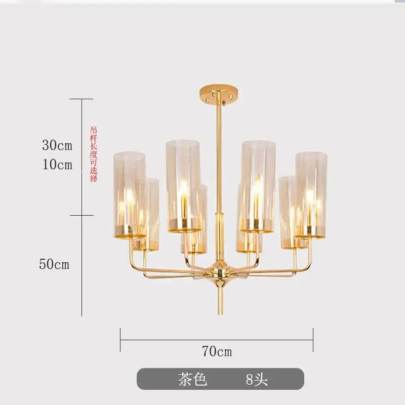Gold-toned decorbites glass chandelier with eight cylindrical glass shades in modern minimalist design for dining rooms