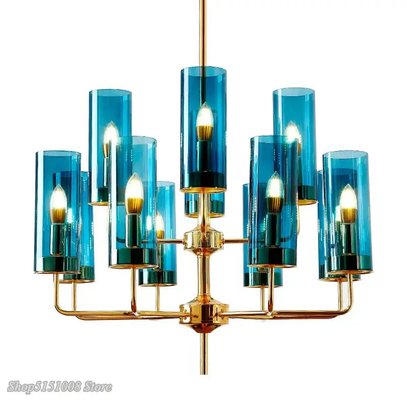Decorbites glass chandelier featuring blue glass cylinder and brass accents with multiple lit bulbs for luxury dining room lighting