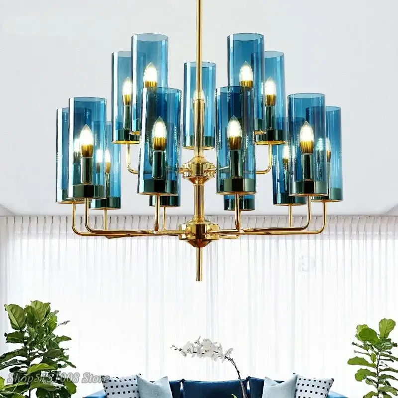 Decorbites glass chandelier featuring blue glass cylinders and gold-toned metal arms for luxury dining rooms