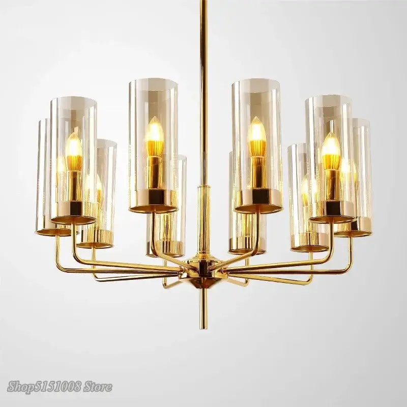 Gold-toned decorbites glass chandelier with cylindrical glass shades and exposed filament bulbs for luxury dining rooms