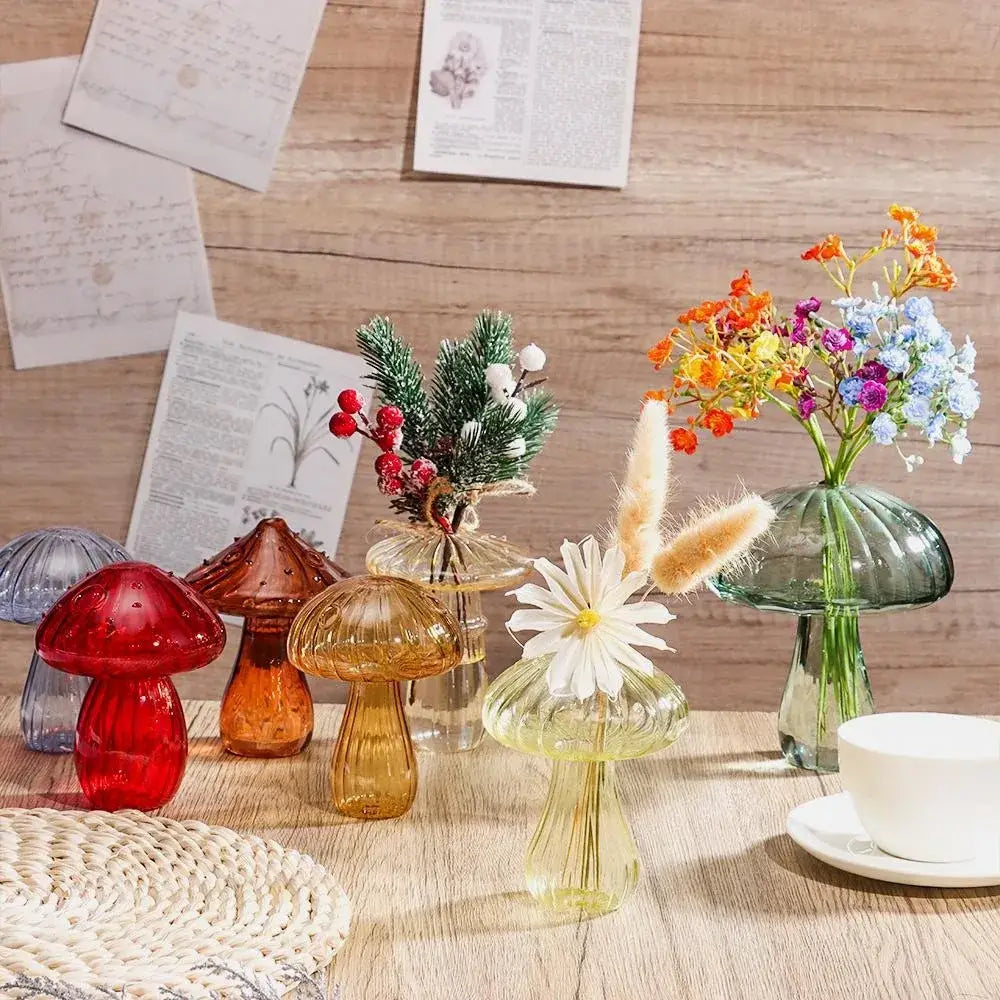 A collection of colorful translucent glass vases in red amber yellow and green for hydroponic flower home decor