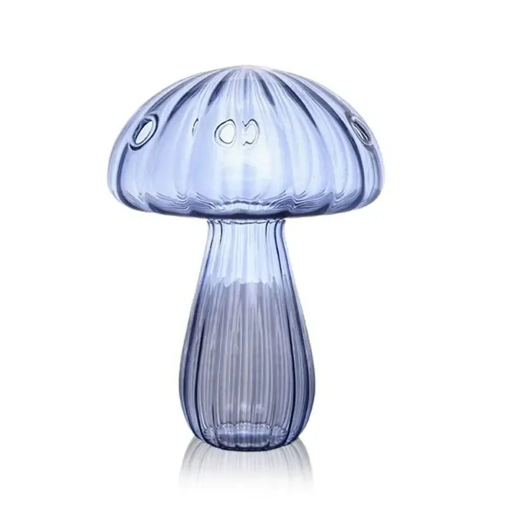 Decorbites™ glass hydroponic flower vase is a translucent blue glass vase with vertical ridges and circular cutouts for home decor
