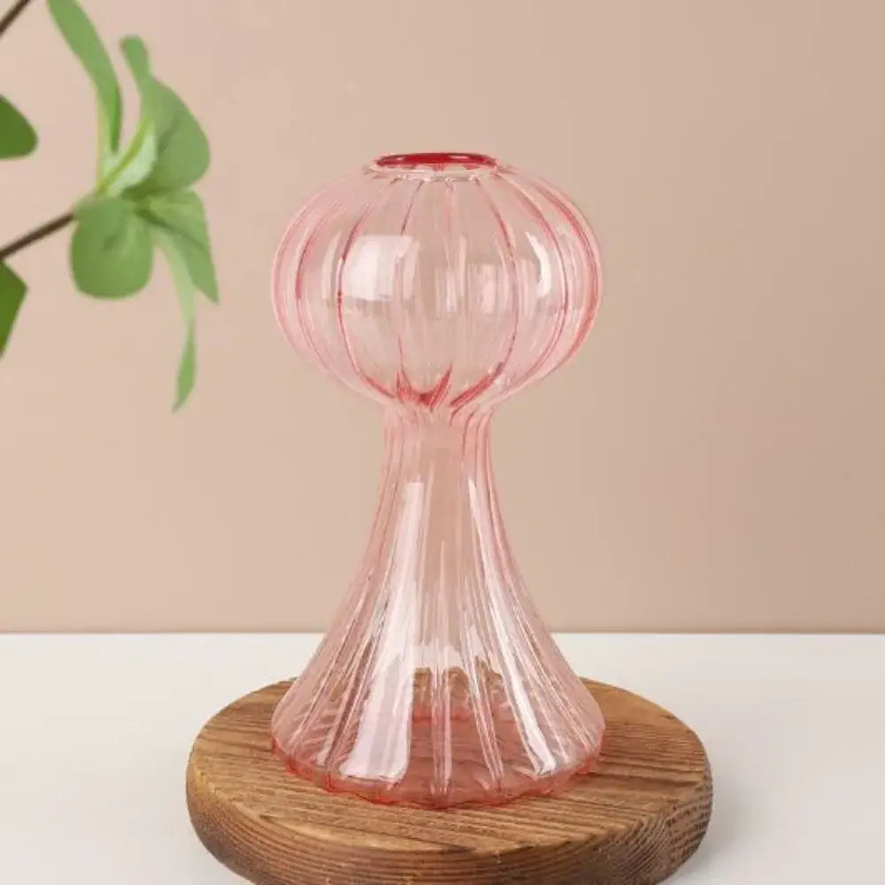 DecorBites™ glass vase in translucent pink with vertical ridges on wooden stand for hydroponic flower home decor