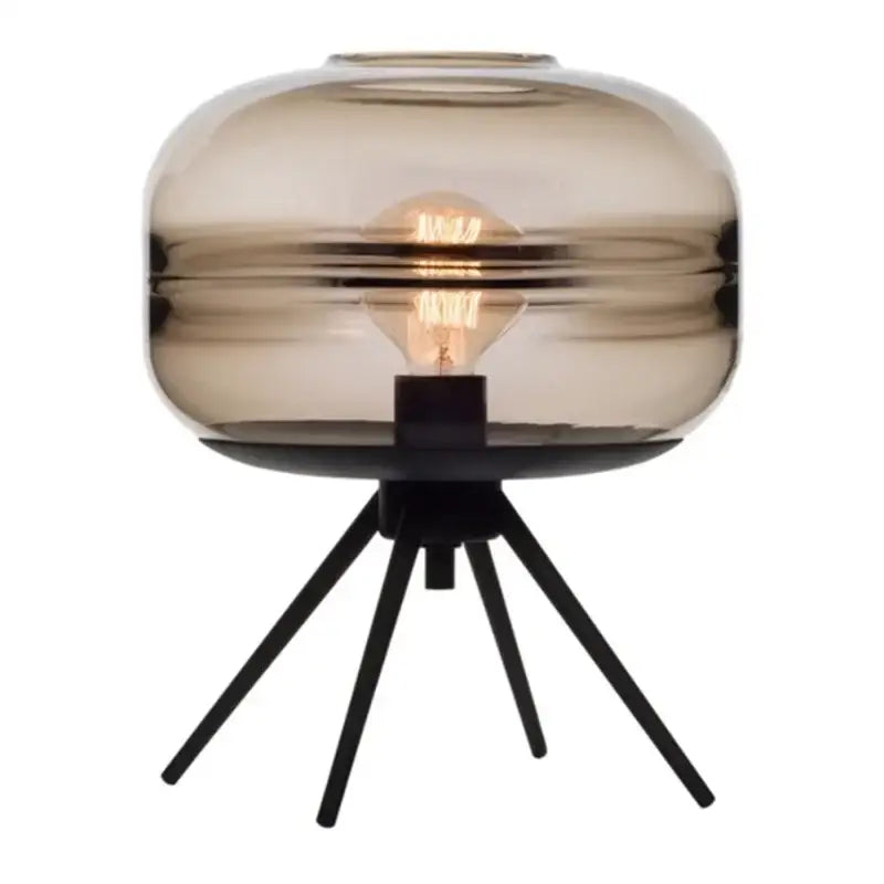 A sleek smoked glass metal nordic sofa desk lamp with tripod base and exposed filament bulb for bedroom use