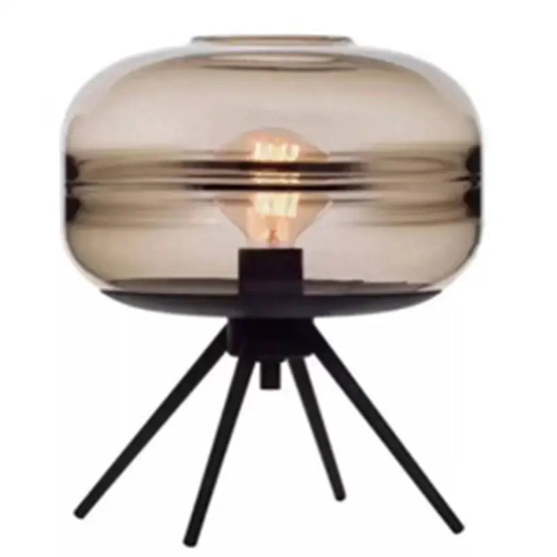 A sleek DecorBites™ glass and metal nordic sofa desk lamp with smoked glass and exposed filament bulb for modern spaces