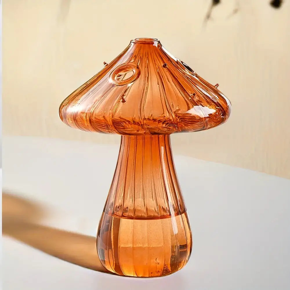 A translucent amber glass mushroom hydroponic planter with vertical ridges and rounded cap for home and garden use
