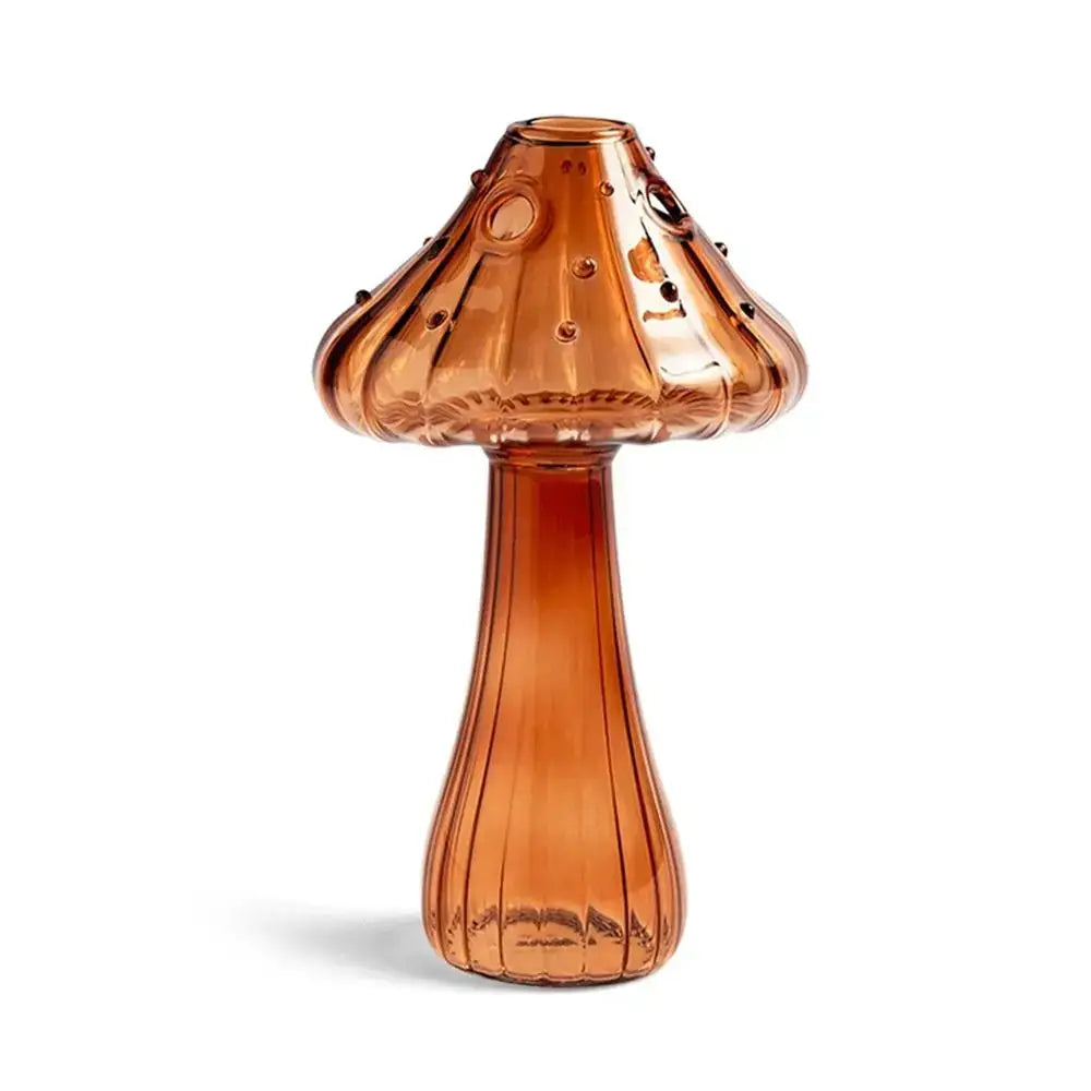 Amber-colored glass mushroom shaped vase with textured ribbed design and decorative dots from DecorBites for home decor