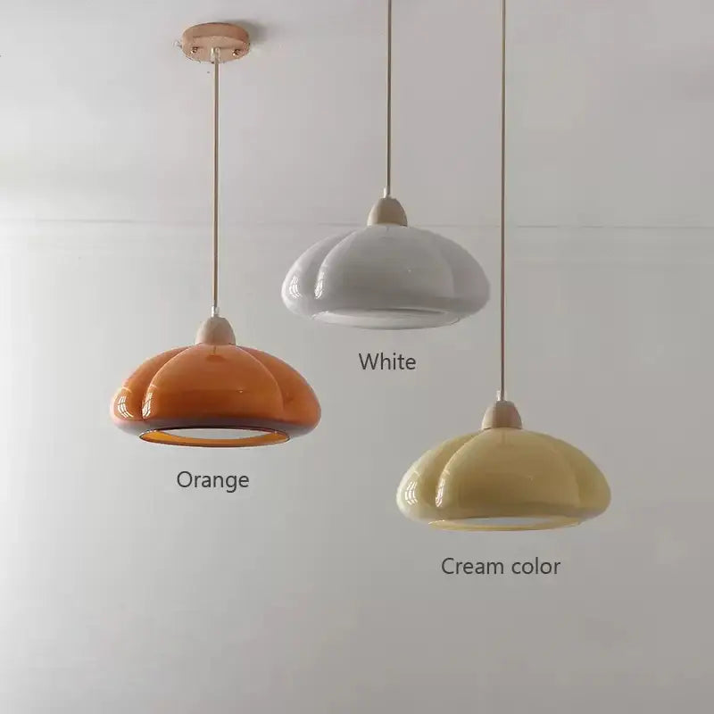 Three ceramic pendant lamps with a soft petal design in orange white and cream for decorbites glass pendant lamps