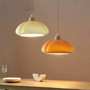 DecorBites™ glass pendant lamps with glossy segmented glass shades in creamy off-white and warm amber hues