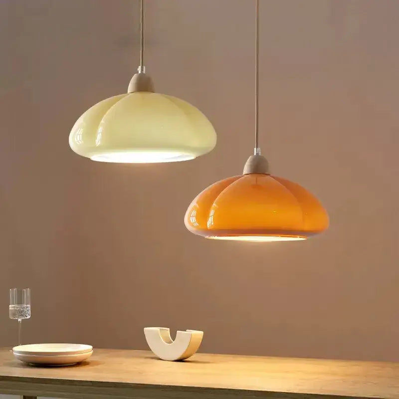 DecorBites™ glass pendant lamps with glossy segmented glass shades in creamy off-white and warm amber hues