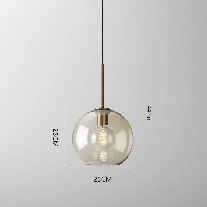 DecorBites™ glass pendant lights featuring a clear glass globe with brass-finished metal rod and exposed filament bulb