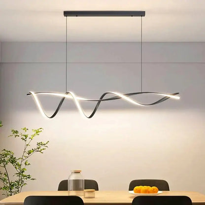 Modern black and white glass pendant lights with sleek wave-like LED design for contemporary home decor by DecorBites