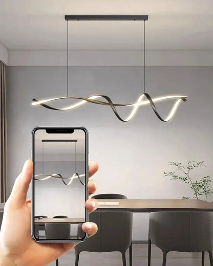 Modern black and gold twisted glass pendant light with sleek flowing design by decorbites pendant lights for home decor