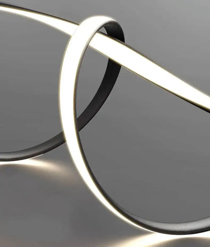 A sleek decorbites glass pendant light with black casing and bright white led illumination for modern home decor