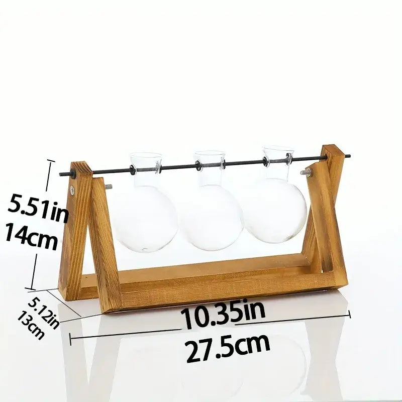 Wooden stand holding three clear glass round necked vials in decorbites glass planter propagation station rack