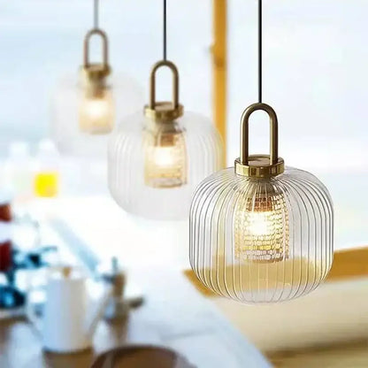 Clear glass decorbites glass stripe pendant lights with vertical ridges and brass-finished frame for dining room use