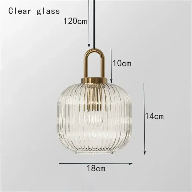 A clear glass stripe brass pendant light with vertical ridges from decorbites ideal for dining room lighting