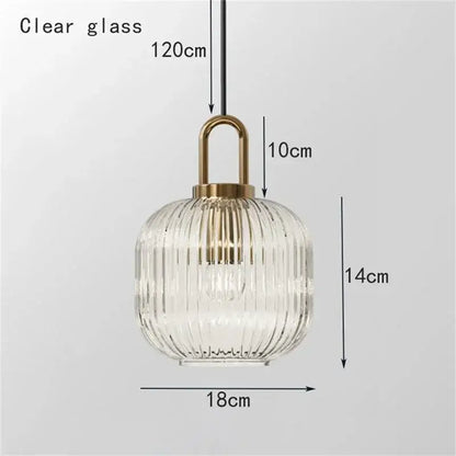 A clear glass stripe brass pendant light with vertical ridges from decorbites ideal for dining room lighting